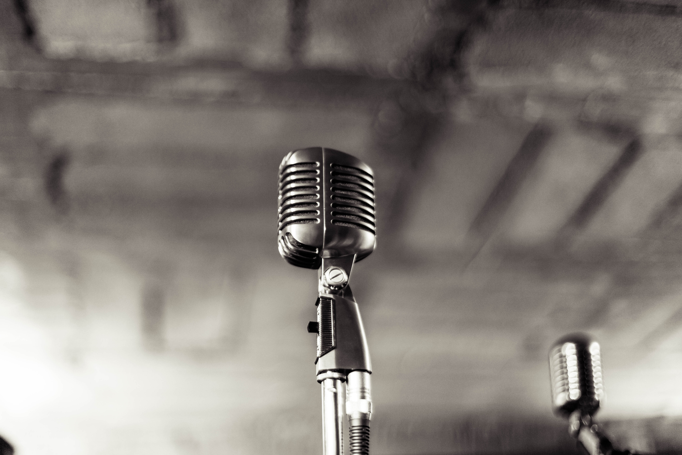 Selective Focus Photography of Grey Condenser Microphone With Stand